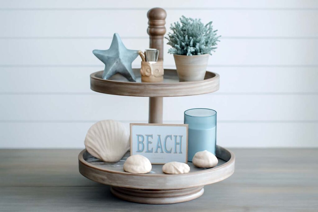 Coastal themed 2 tier tray with seashells and beach decor