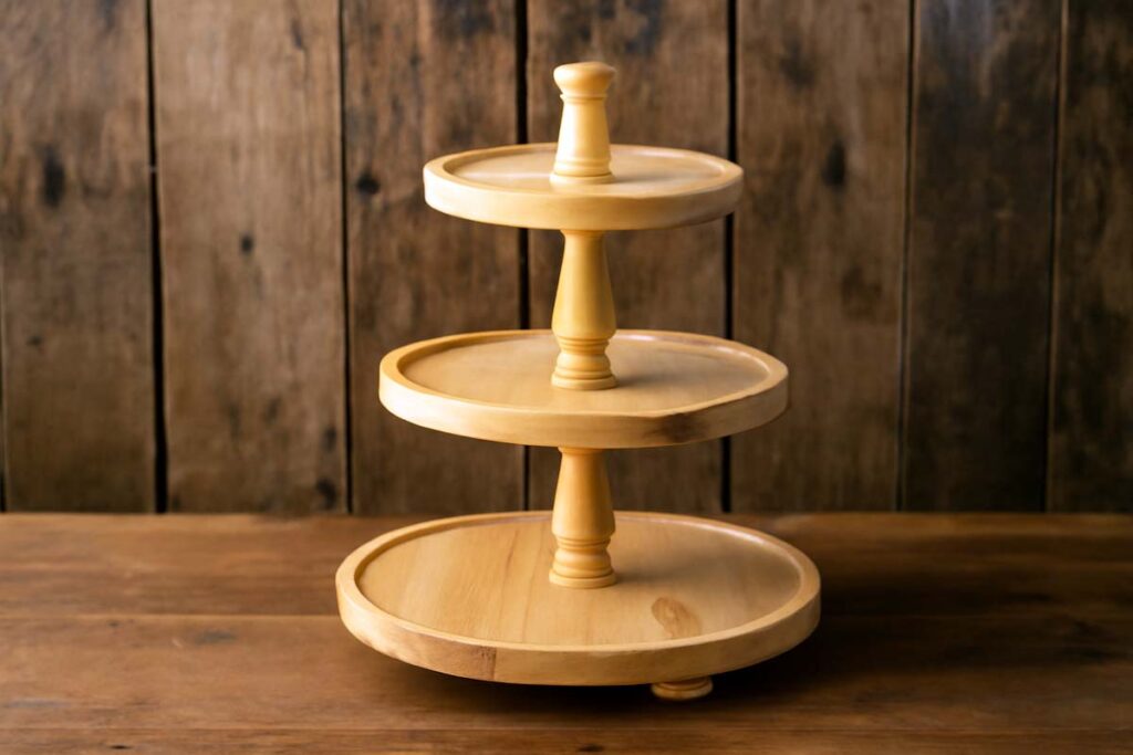 Pine wood tiered tray stand with visible knots and rustic finish