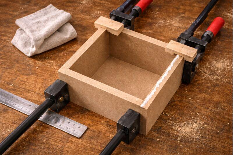 overhead view of clamped mdf corner with glue squeeze out