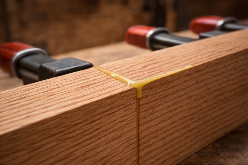 close-up of glue squeeze out on clamped oak joint