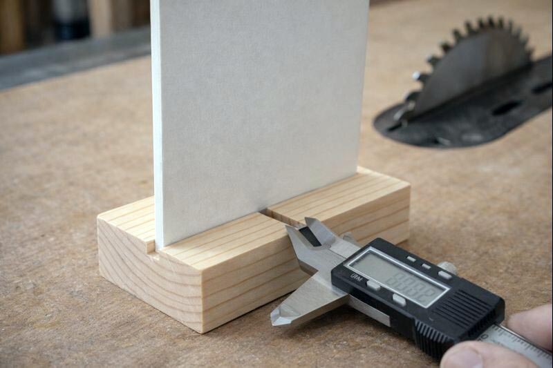 simple wood base block with a kerf slot holding a mini sign