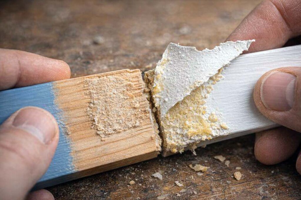 peeled paint stuck to dried glue after joint failure