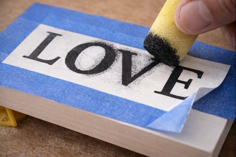 dabbing stencil paint for crisp lettering on a mini sign