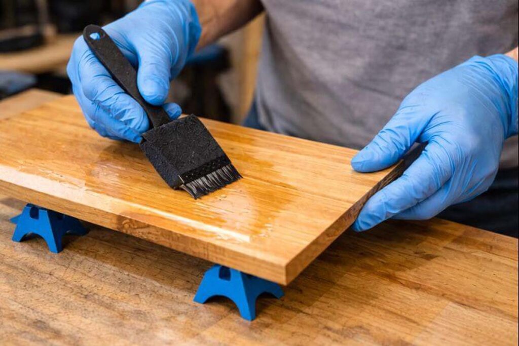 applying a thin coat of water based polyurethane with a foam brush
