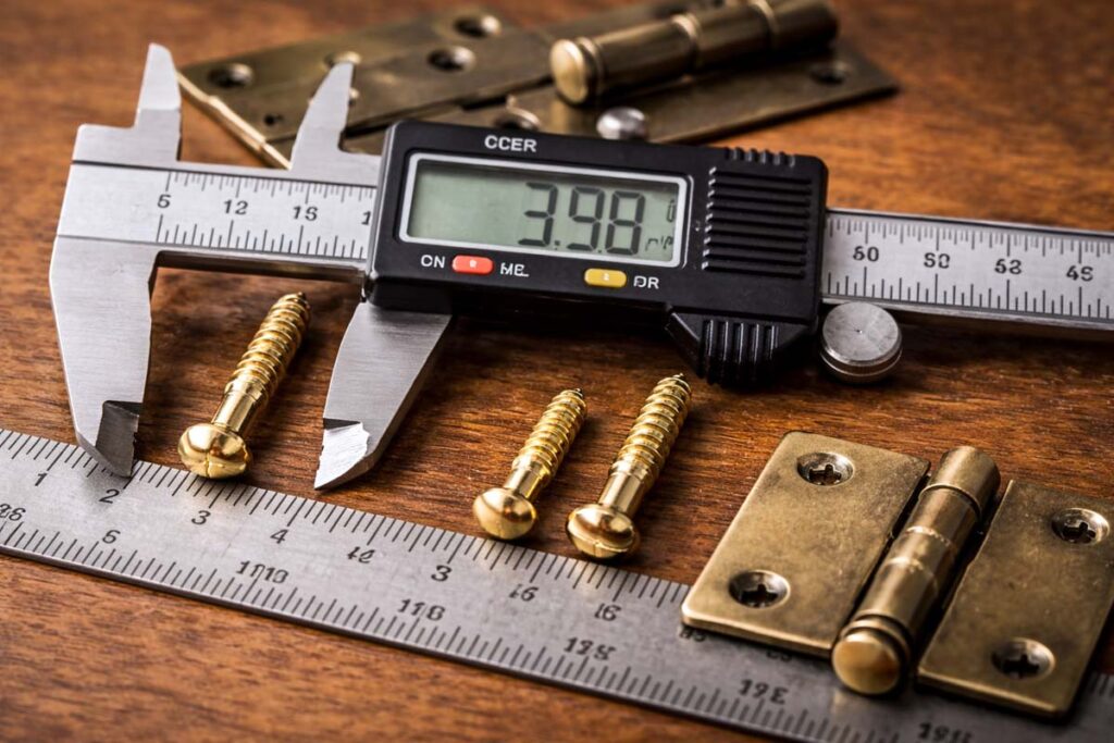 decorative wood screw measured with ruler and calipers
