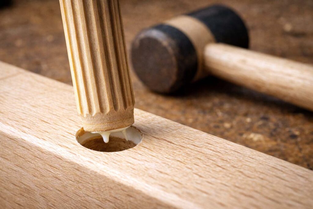 fluted dowel pin entering hole with glue filling flutes