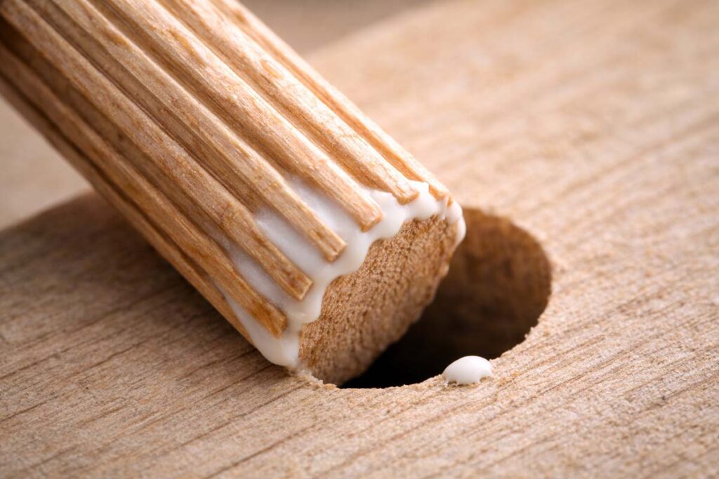 a fluted dowel pin spreading glue in a drilled hole