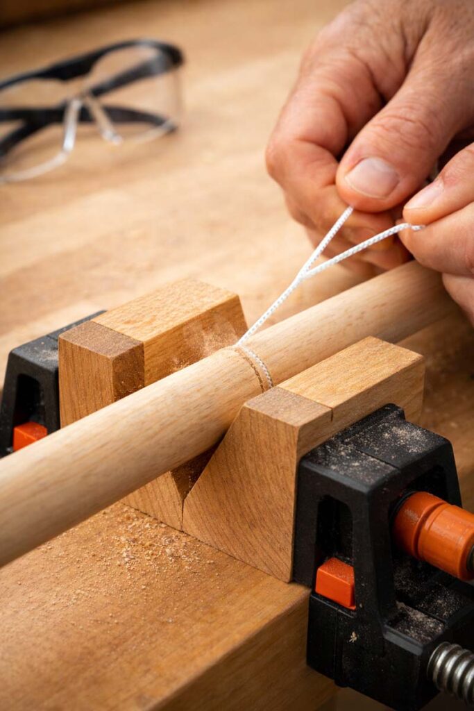 nylon cord cutting groove into small dowel
