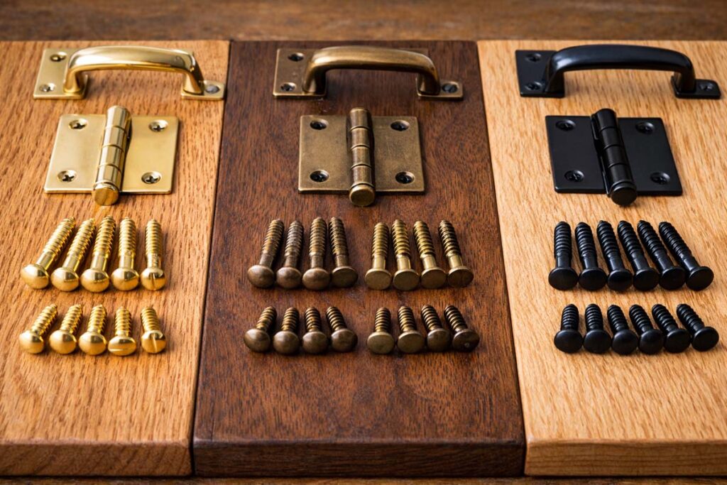 screws matching hinge and handle finishes on cabinet door sample